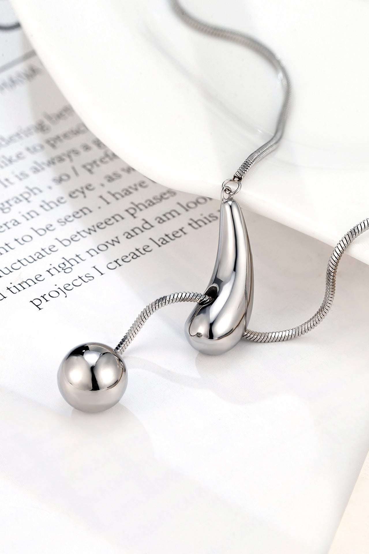 Creative Drawstring Water Drop Ball Necklace Titanium Steel